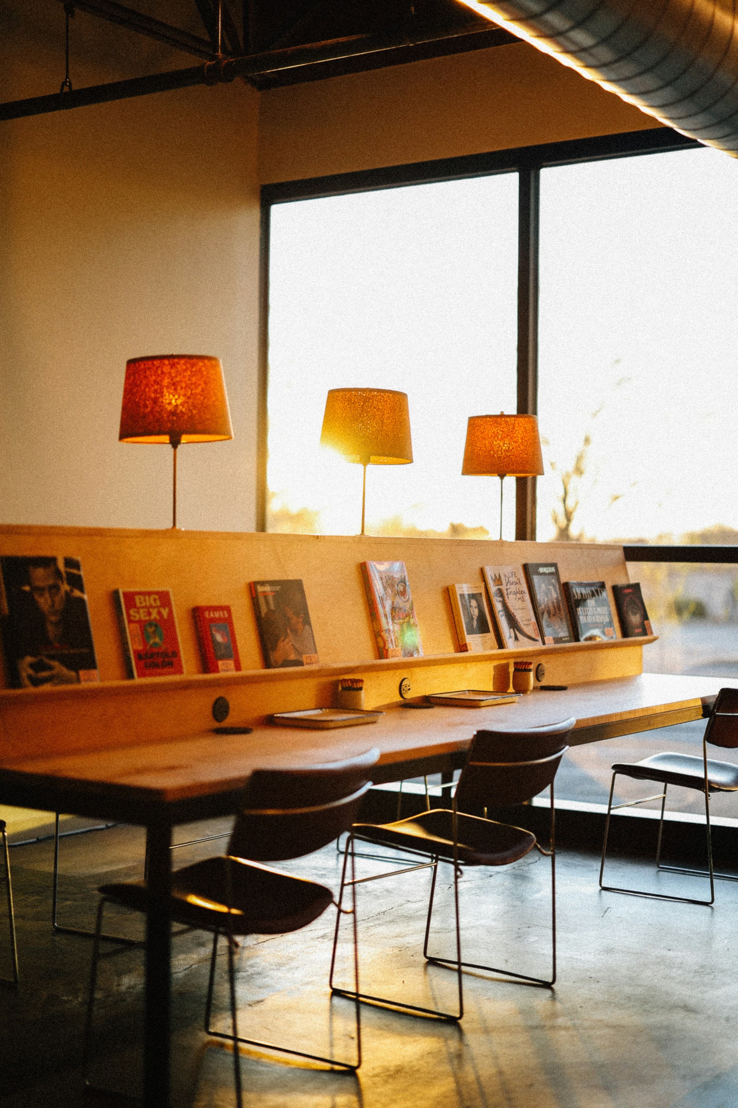 Reading room with warm lamps and a quiet evening atmosphere