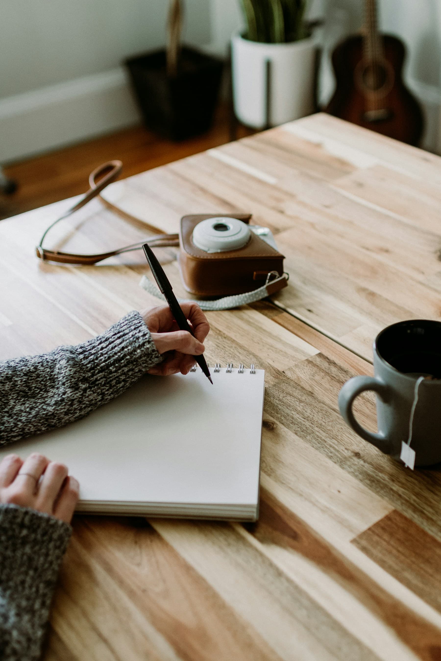 Handwritten notes and a private study notebook on a warm table